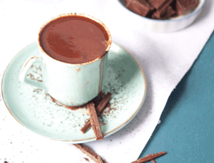 gluten free wanderfood catering cocoa powder drink in white cup 